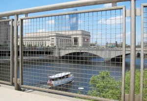 Framed wire mesh infill panel overlooking city